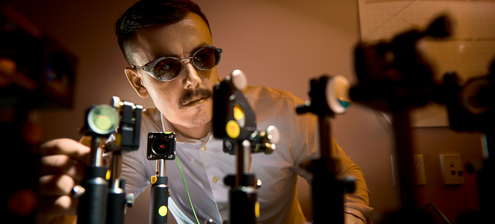 MSU research engineer Andre Olearain tunes a laser setup in MSU’s Spectrum Lab. The lab was created in 1999 to develop Montana-grown optics technologies and help transfer them to industry. MSU photo by Colter Peterson.