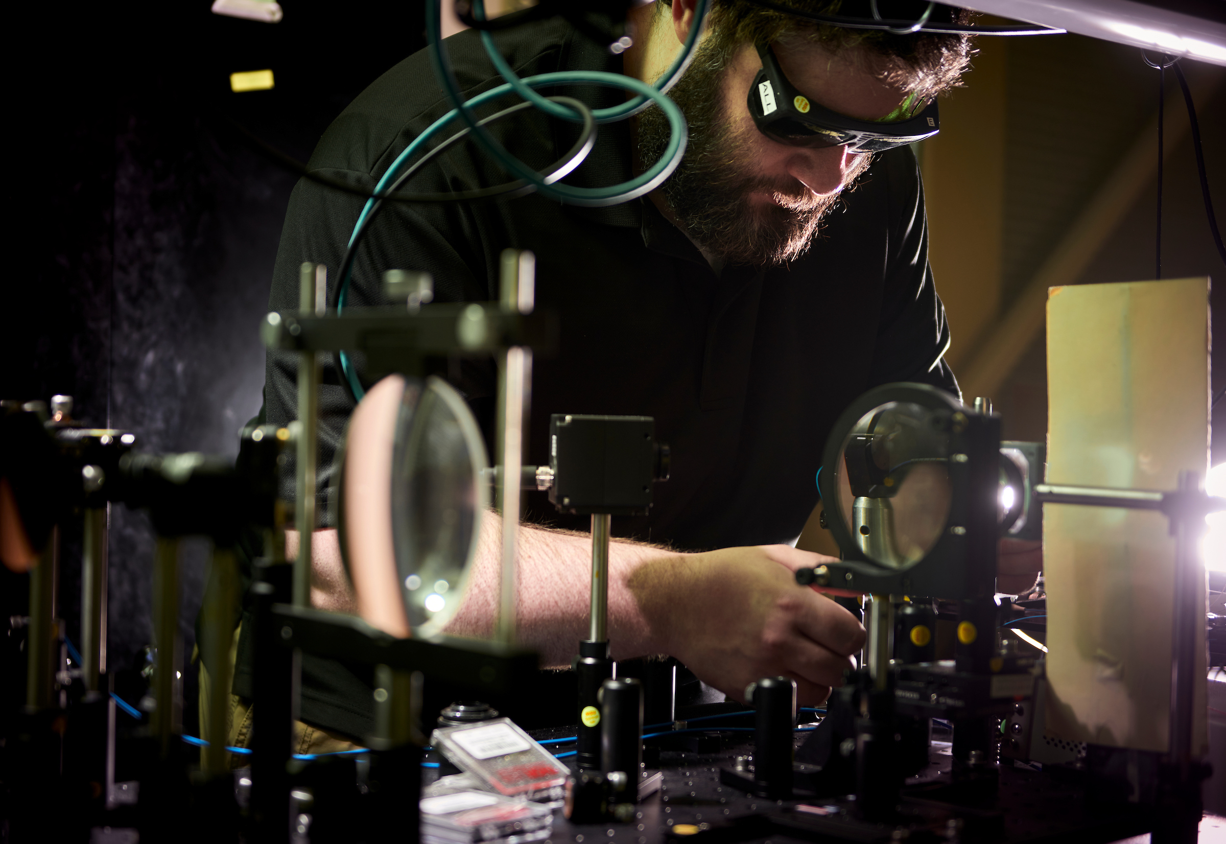 Matt Goodman working on a bench-top optical system