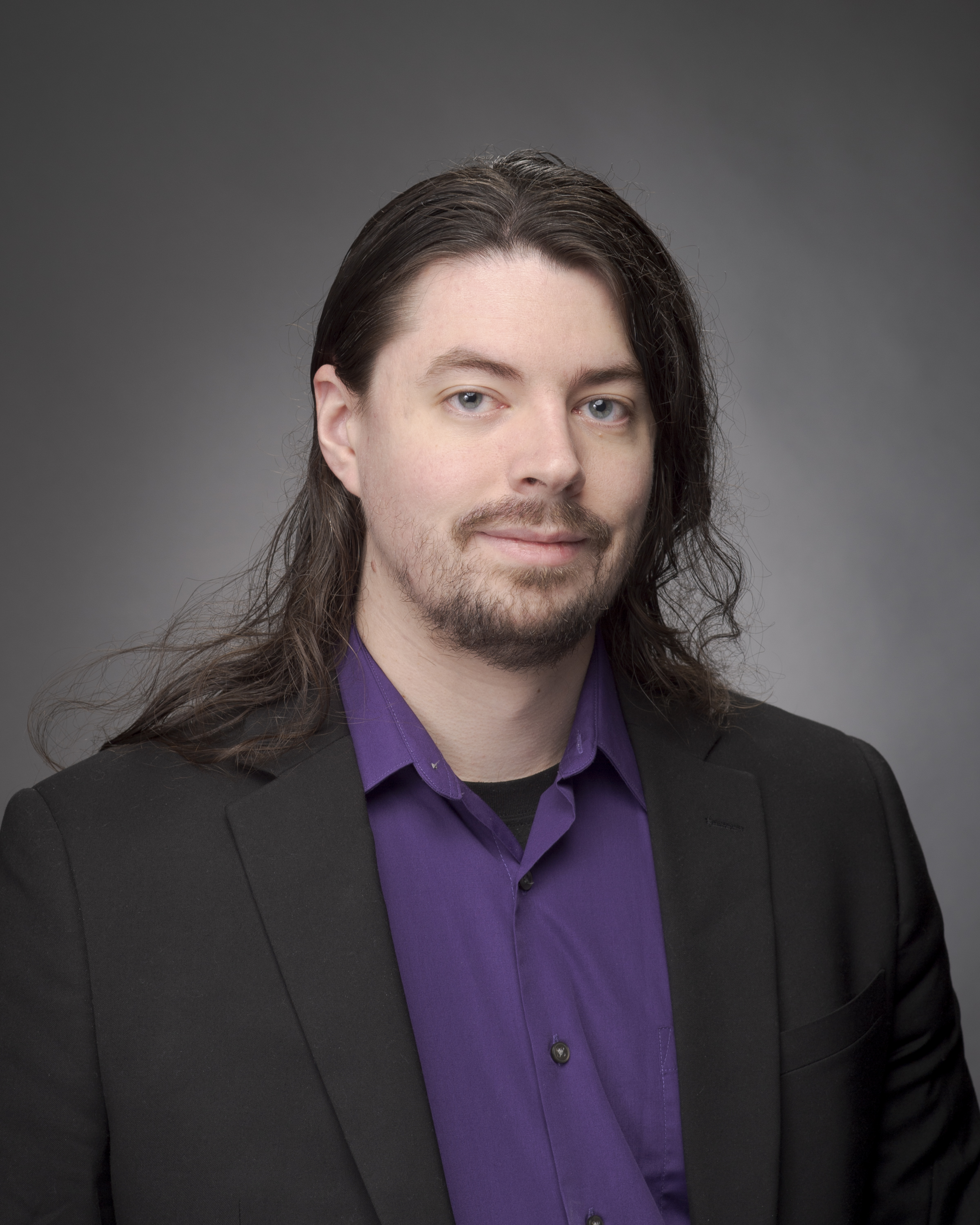 Staff head shot of Joshua Dugre